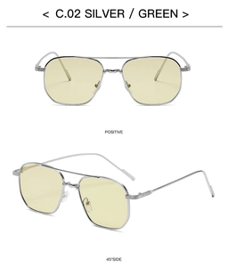 Detail view of silver metal aviator sunglasses with dual beam and light green lenses