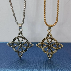 Men's Slavic Celtic knot necklaces in gold and silver finish hanging over a blue background