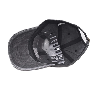 Detail view of washed cotton baseball cap interior featuring sweatband and adjustable buckle