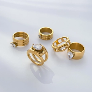 Five-piece 18K gold plated titanium ring set with oval and teardrop zircon accents