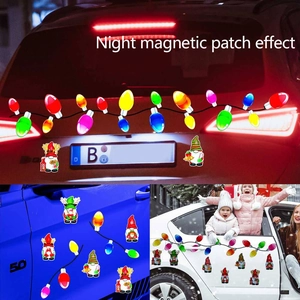 Macro view of reflective Christmas gnome and bulb magnetic decals for car decoration