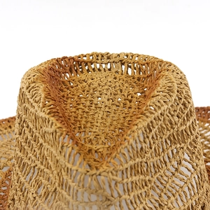 Macro shot of breathable hollow-weave texture on natural straw cowboy hat