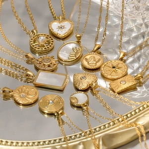 Detail of vintage 18k gold plated titanium bracelets with cubic zirconia pendants