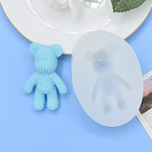 3D bear silicone mold for resin or soap with a textured blue bear figurine on a plate