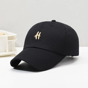 Classic black cotton baseball cap with gold embroidered H letter and curved brim