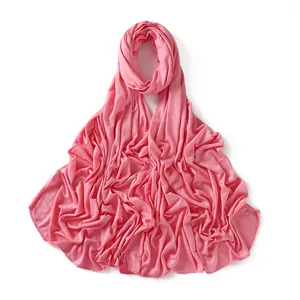Detail of pink jersey modal scarf showing soft fabric texture and fine hemmed edges