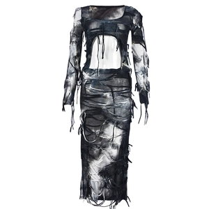 Detail of tie-dye mini dress featuring waist cut-outs and distressed fringe textures