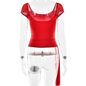 Macro detail of red slim fit top showing square backless design and sheer mesh sleeves