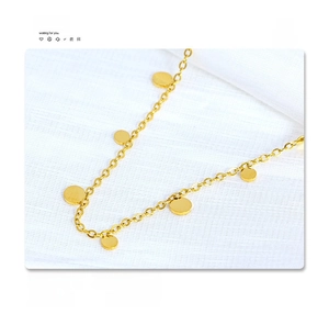 Detail showing 18K gold plated titanium steel necklace with small round disc pendants