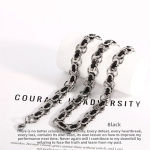 Close-up of black and silver Byzantine titanium steel chain with a lobster clasp