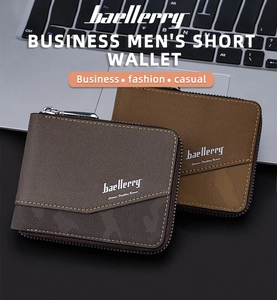 Short leather bifold wallets for men shown in dark and light brown on a laptop keyboard