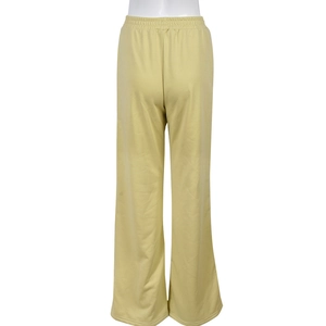 Detail of high elastic smocked waistband on mustard green wide leg leisure pants