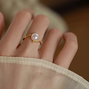 Close-up of S925 sterling silver golden bamboo ring featuring a white round pearl