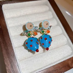 Blue strawberry glass earrings with silver needles and crystal leaf accents