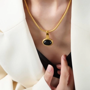 French vintage 18k gold plated titanium steel necklace with black oval glass pendant