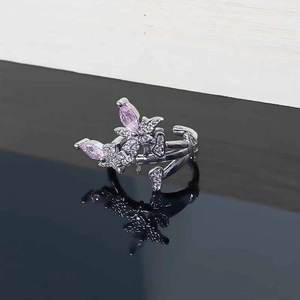 Detail of silver adjustable ring with pink marquise zircon and butterfly design