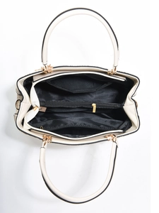 Top view of beige tote bag interior showing black lining and dual gold zipper pockets