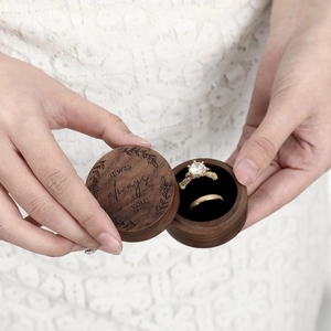Detail of walnut wood heart ring box with 'it was always you' engraving for proposals