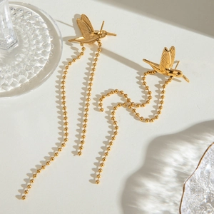 Golden stainless steel peace bird earrings with elegant long bead chain tassels