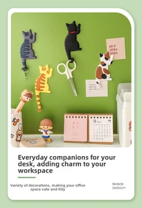 Practical usage of four cartoon cat tail magnetic fridge hooks holding keys and tools