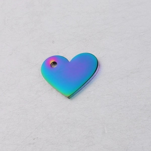 Detailed macro view of heart-shaped hollow metal pendant with colorful iridescent finish