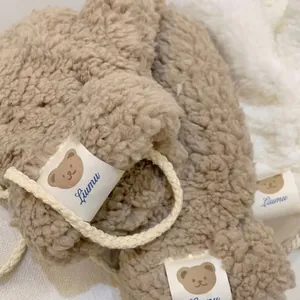 Plush lamb wool winter gloves in light coffee brown with cute bear patch and neck cord