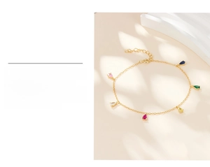 Detail of gold plated chain featuring teardrop colored zircons and thick real gold plating