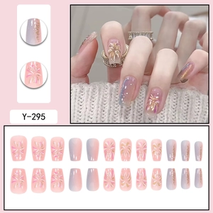 Pink and blue gradient press-on nails with golden fireworks and glitter finish