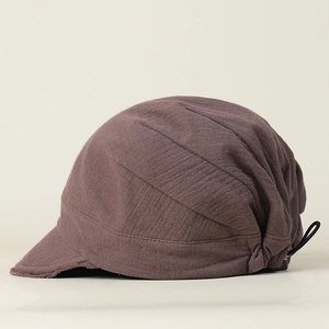 Detail of breathable brown cotton linen newsboy hat with adjustable elastic drawstring