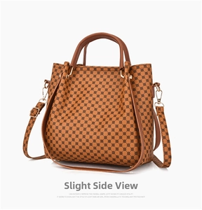 Detail view of the brown geometric print handbag with golden protective base studs