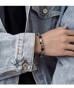 Close-up of beaded bracelet with black hematite and irregular silver titanium steel beads