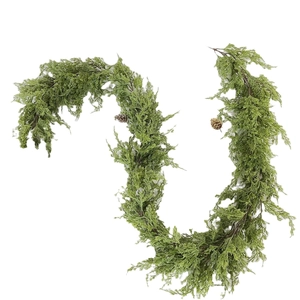 Artificial Christmas cedar garland with pine cones on white background for holiday decor