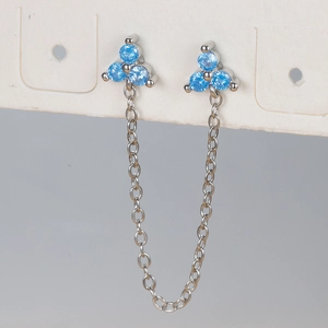 Silver chain tassel earrings featuring light blue flower zirconia on white card
