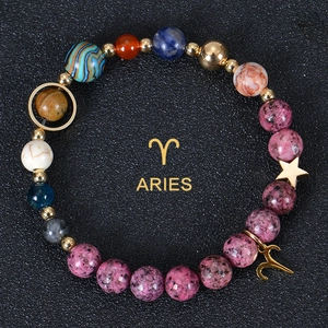 Detail of Aries natural stone bead bracelet with pink rhodochrosite and gold star charm