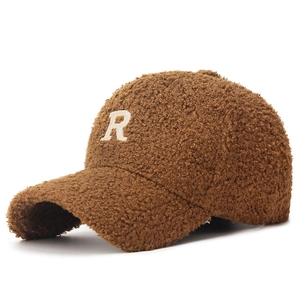 Brown sherpa baseball cap with embroidered letter R in a stylish winter fashion style