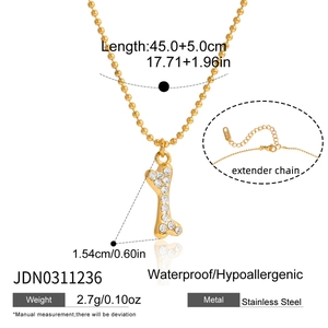 Detail of 18K gold plated bone pendant with crystals and stainless steel bead chain