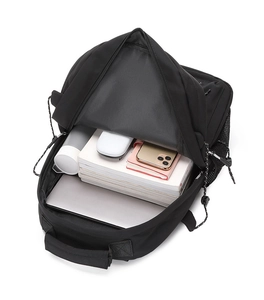 Top view of high-capacity black backpack interior showing organized storage for laptop and books