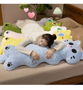 Close-up of soft colorful animal plush pillows with embroidery detail and textured fabric
