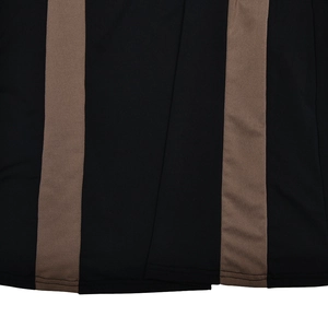 Detail of the vertical black and brown patchwork fabric with double-needle hem stitching