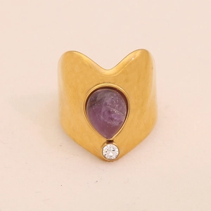 Vintage gold wavy ring with purple teardrop gemstone and white round crystal accent