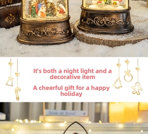 Detail of vintage copper base and Nativity scene inside a glowing Christmas snow globe