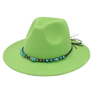 Detail of emerald green felt cowboy hat with ethnic style turquoise bead band and metal accents
