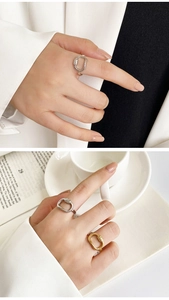 Detail view of irregular twisted 18K gold and silver plated stainless steel rings