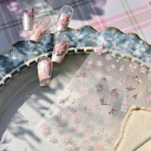 Holographic butterfly and flower nail art stickers with shell-like shimmer effects