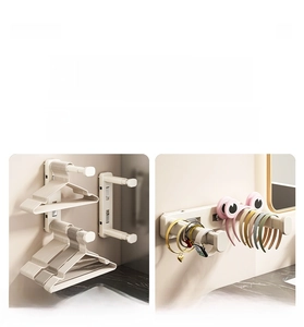Detail of adjustable wall-mounted rack showing versatile storage for hangers and accessories