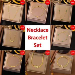 Elegant gold-plated jewelry sets featuring heart and butterfly pendants in gift boxes