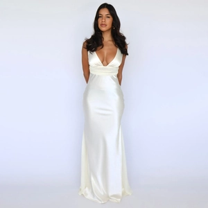 Elegant white satin V-neck sleeveless backless floor-length evening gown on a model
