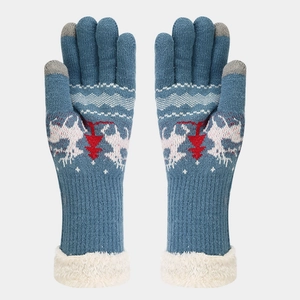 Detail of Christmas knit gloves with reindeer pattern and warm faux cashmere cuffs