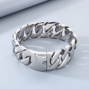Detail shot of wide silver chunky Cuban chain necklace with high polished metallic finish