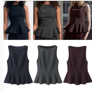 Detail view of peplum top in black pinstripe, dark grey, and wine red styles